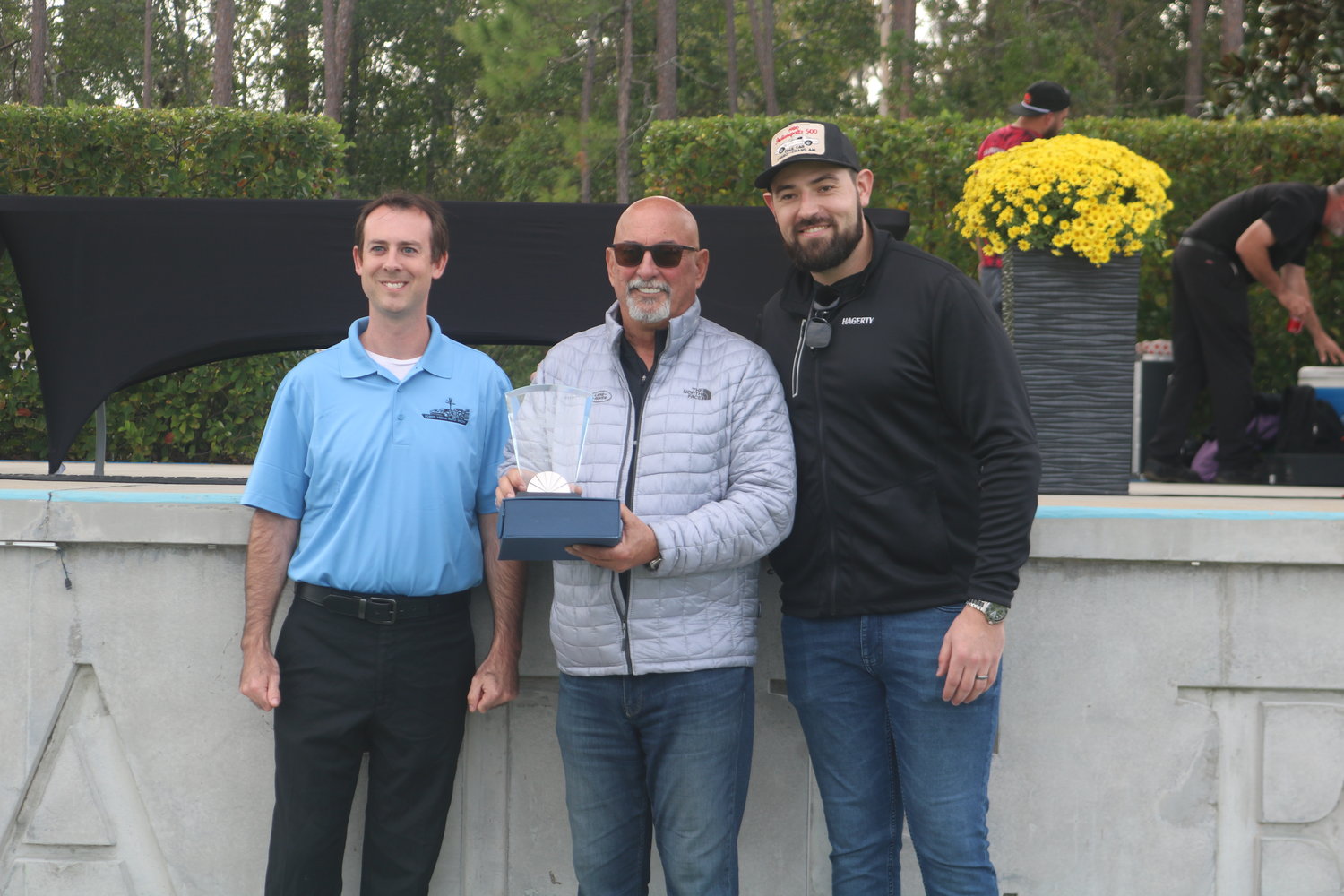Bobby Rahal (center) receives his award for “Best in Show” at the 2022 Ponte Vedra Auto Show.